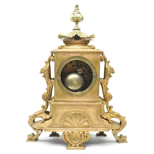 86 - A French late 19th - early 20th century gilt metal two train mantel clock. The mantle clock featurin... 