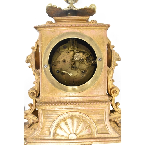 86 - A French late 19th - early 20th century gilt metal two train mantel clock. The mantle clock featurin... 