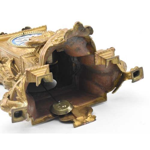 86 - A French late 19th - early 20th century gilt metal two train mantel clock. The mantle clock featurin... 