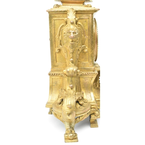 86 - A French late 19th - early 20th century gilt metal two train mantel clock. The mantle clock featurin... 