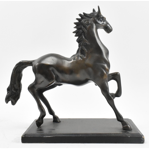 94 - A 20th century lost wax bronze sculpture figure of galloping horse. The figure depicting a horse wit... 