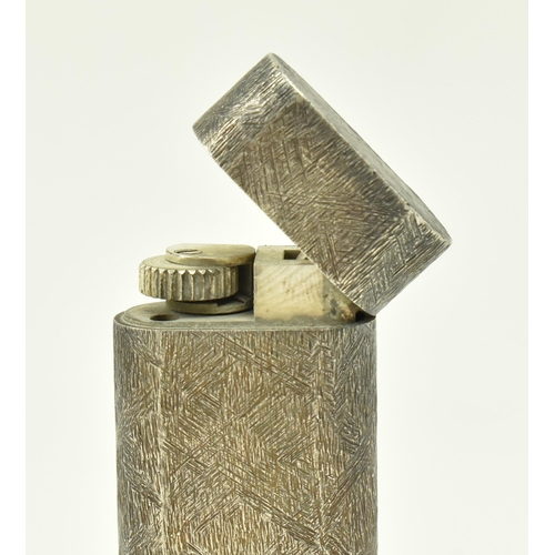96 - Cartier - a 20th century Cartier silver plated cigarette lighter having brushed texture to surface. ... 