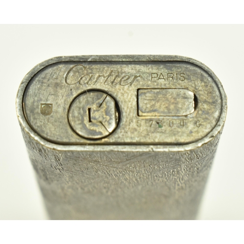 96 - Cartier - a 20th century Cartier silver plated cigarette lighter having brushed texture to surface. ... 