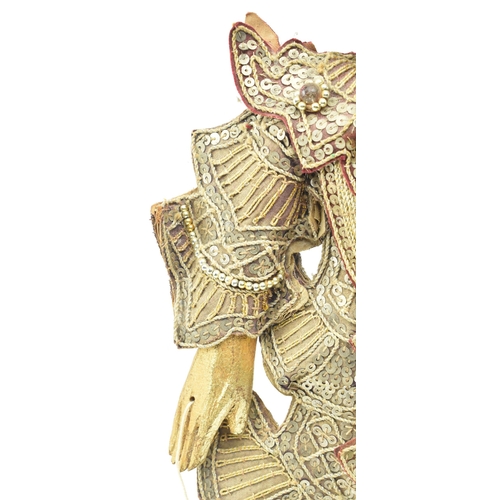 98 - A Burmese Oriental 20th century glass and sequin-adorned gilt wood marionette of possibly a Buddhist... 