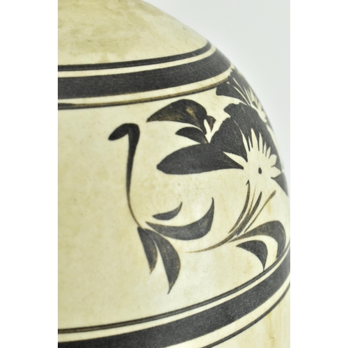 111 - A Chinese Cizhou meiping vase. The meiping vase modelled a short neck with everted rim, the body cov... 