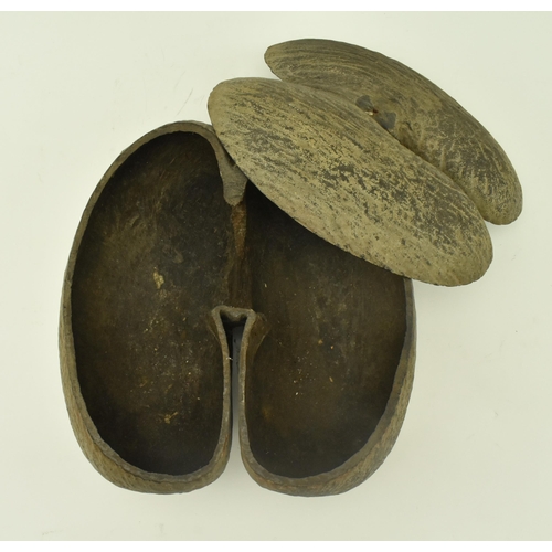 73 - An unpolished Coco de Mer (Lodoicea Maldivica) nut with cut top. Measures approx. 17cm x 33cm x 27cm... 
