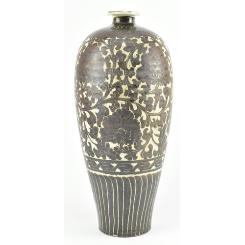 91 - A Yuan dynasty Cizhou brown glazed ceramic meiping vase. The baluster body with carved peonies and f... 