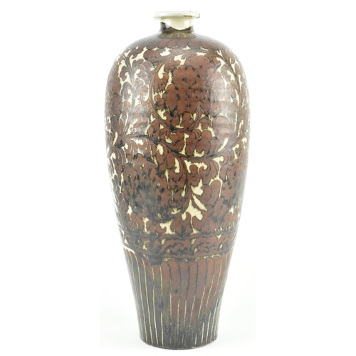 91 - A Yuan dynasty Cizhou brown glazed ceramic meiping vase. The baluster body with carved peonies and f... 