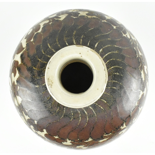 91 - A Yuan dynasty Cizhou brown glazed ceramic meiping vase. The baluster body with carved peonies and f... 