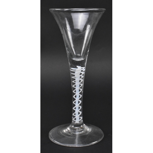 71 - A George III mid 18th century hand blown lead glass double series opaque twist stem wine glass. The ... 