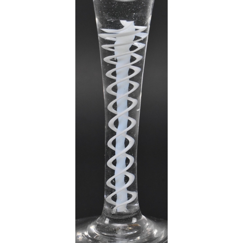 71 - A George III mid 18th century hand blown lead glass double series opaque twist stem wine glass. The ... 