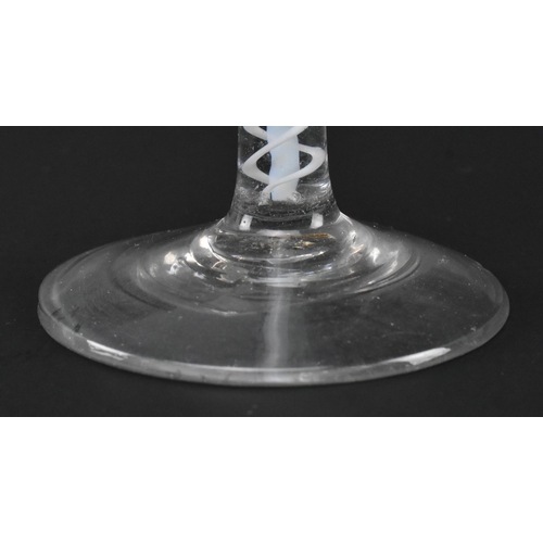 71 - A George III mid 18th century hand blown lead glass double series opaque twist stem wine glass. The ... 