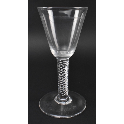 97 - A George III late 18th century hand blown lead glass double series air twist stem wine glass. The gl... 