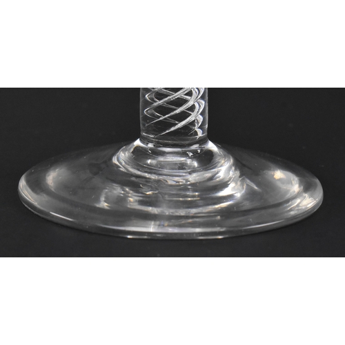 97 - A George III late 18th century hand blown lead glass double series air twist stem wine glass. The gl... 