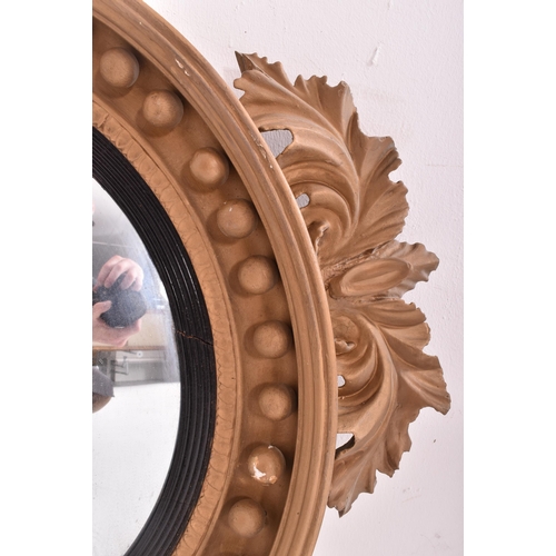 257 - A large Regency 19th century gilt gesso and wood circular convex wall hanging mirror. The mirror hav... 