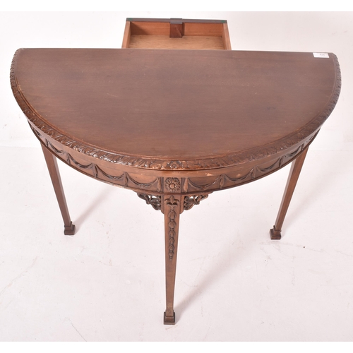 266 - An Adams Revival early 20th century mahogany demi-lune side hall table. The table having a half mood... 