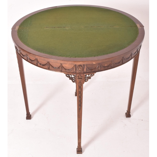 266 - An Adams Revival early 20th century mahogany demi-lune side hall table. The table having a half mood... 