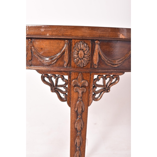 266 - An Adams Revival early 20th century mahogany demi-lune side hall table. The table having a half mood... 