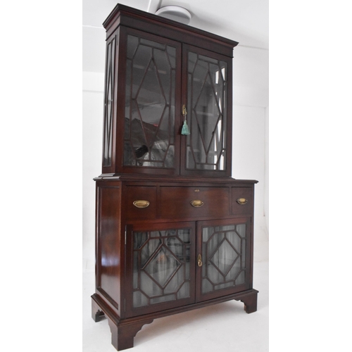 272 - A George III early 19th century mahogany & glazed library bookcase cabinet. The bookcase having an a... 