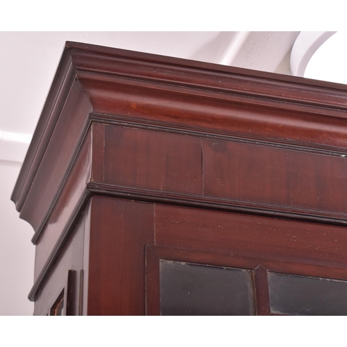 272 - A George III early 19th century mahogany & glazed library bookcase cabinet. The bookcase having an a... 