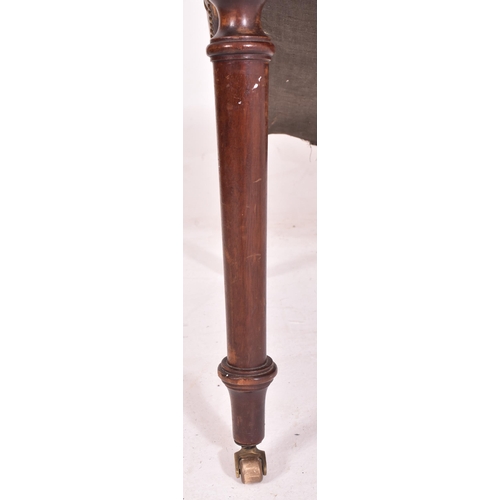 275 - A 19th century leather buttoned gout stool. The stool of mahogany construction with button backed ch... 