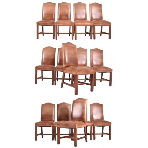 279 - A set of fourteen Gainsborough style studded brown leather and mahogany high back dining chairs. Eac... 