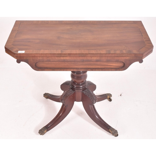 281 - A 19th century William IV Regency mahogany games / card table. The fold over swivel top supported by... 