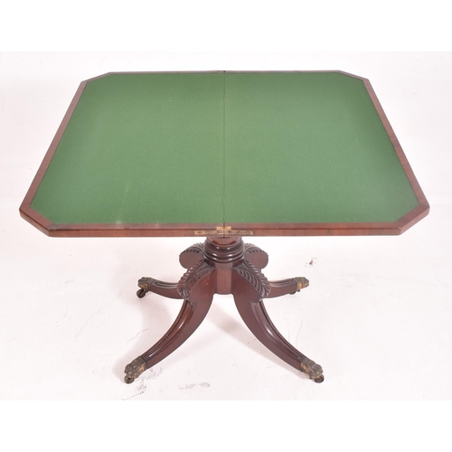 281 - A 19th century William IV Regency mahogany games / card table. The fold over swivel top supported by... 