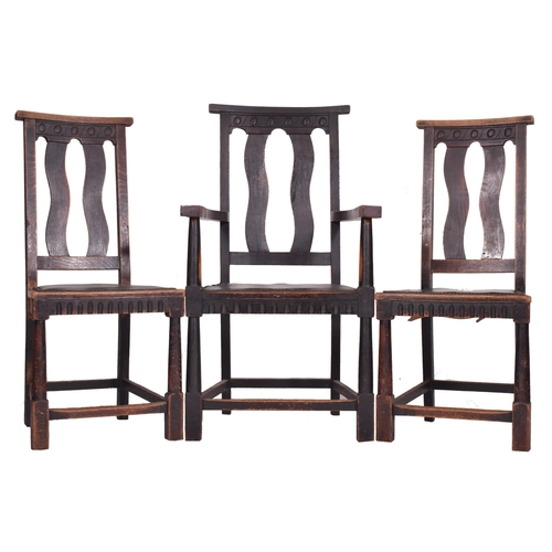 283 - A set of six early 20th century Arts & Crafts oak dining chairs. The set of six chairs (two being ca... 