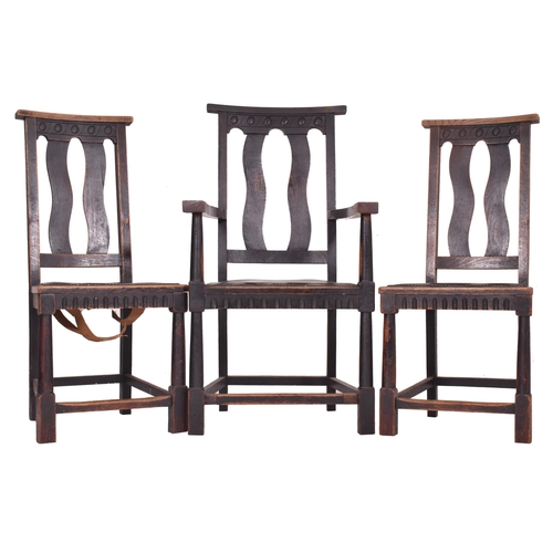 283 - A set of six early 20th century Arts & Crafts oak dining chairs. The set of six chairs (two being ca... 