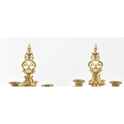 293 - A pair of French Louis XVI style 19th century gilt metal & ceramic desk table candelabras. Each havi... 