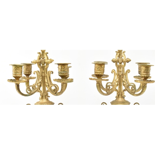 293 - A pair of French Louis XVI style 19th century gilt metal & ceramic desk table candelabras. Each havi... 