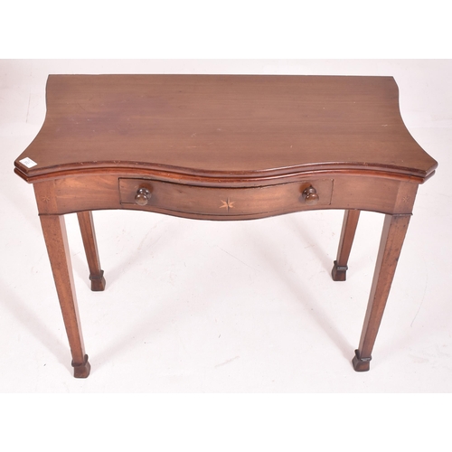 302 - A George III early 19th century mahogany serpentine front card / tea table. The table having a shape... 