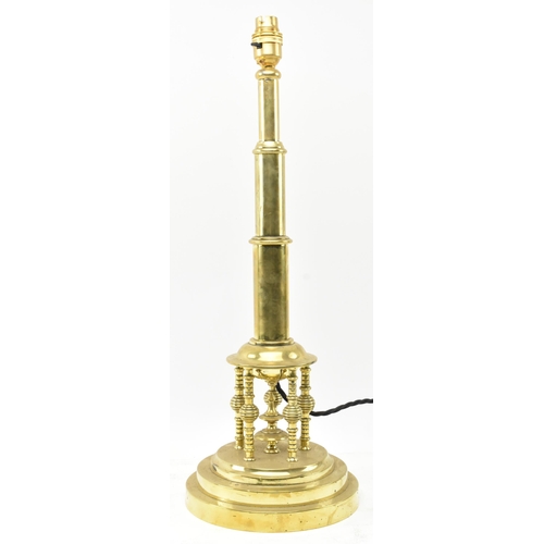 304 - A Secessionist Inspired 20th century brass desk table lamp light. The lamp having a single stepped g... 