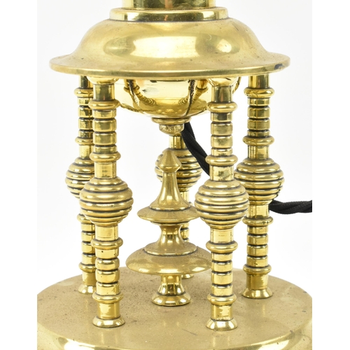 304 - A Secessionist Inspired 20th century brass desk table lamp light. The lamp having a single stepped g... 