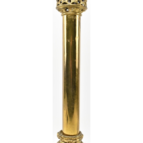 309 - A Neoclassical inspired 20th century brass desk table lamp light. The lamp having a pierced capital ... 