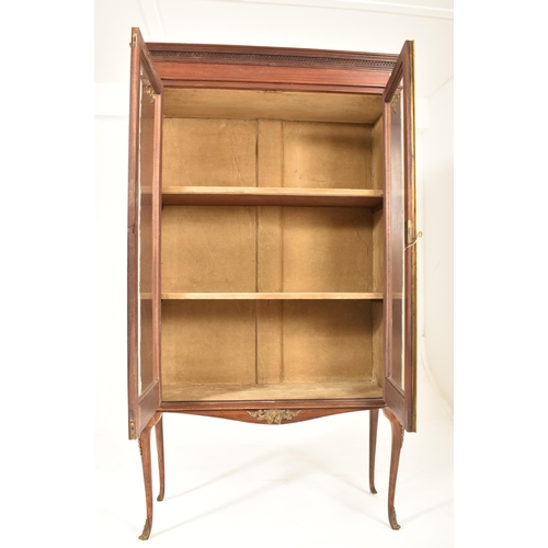 314 - A Victorian 19th century mahogany cabinet on stand. The twin door glazed top housing a series of she... 