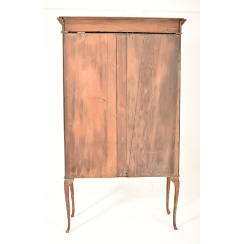 314 - A Victorian 19th century mahogany cabinet on stand. The twin door glazed top housing a series of she... 