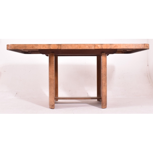 318 - An Art Deco early 20th century circa 1930s figured walnut veneered extending dining table with six c... 