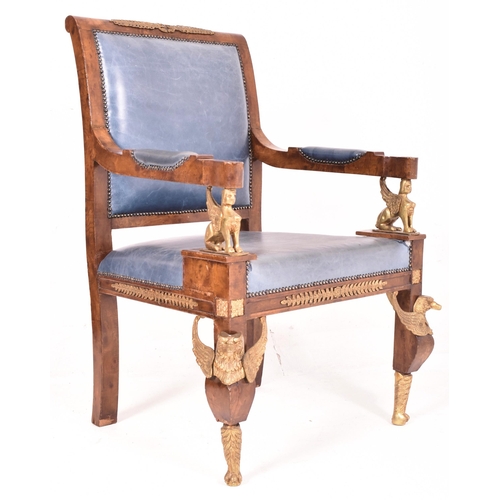 321 - A French Empire style Egyptian revival walnut veneered & brass mounted armchairs. The chair having a... 