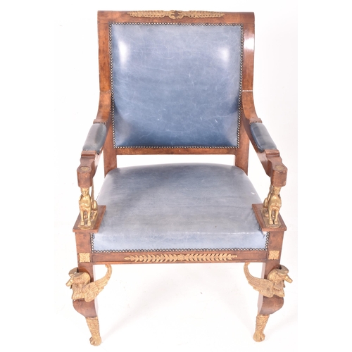 321 - A French Empire style Egyptian revival walnut veneered & brass mounted armchairs. The chair having a... 