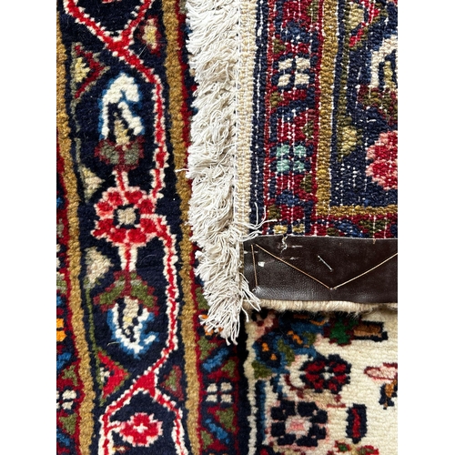 324 - A 20th century North West Persian Islamic Sarouk floor carpet runner rug. The runner rug having cent... 