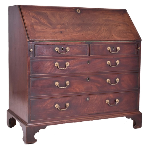 325 - A George III 18th century flame mahogany fall front writing bureau desk. The bureau having a fall fr... 