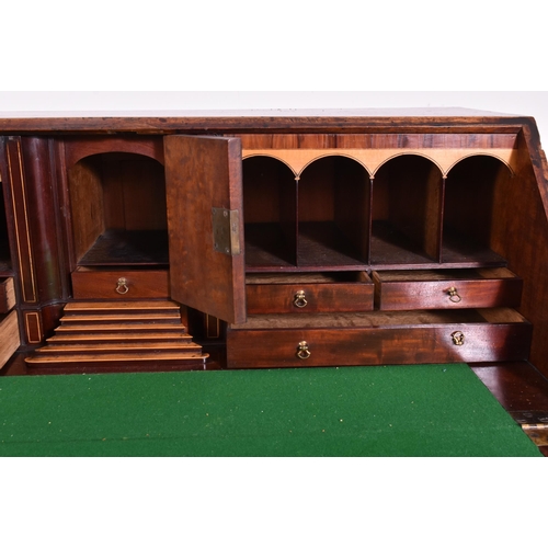 325 - A George III 18th century flame mahogany fall front writing bureau desk. The bureau having a fall fr... 