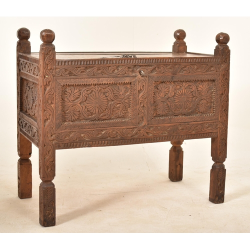 330 - An Indian Damchiya 19th century carved wood Dowry chest trunk on legs. The chest having carved finia... 