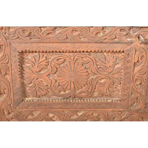 330 - An Indian Damchiya 19th century carved wood Dowry chest trunk on legs. The chest having carved finia... 