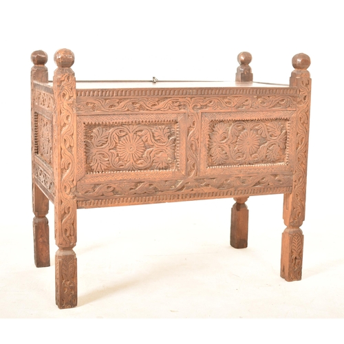 330 - An Indian Damchiya 19th century carved wood Dowry chest trunk on legs. The chest having carved finia... 