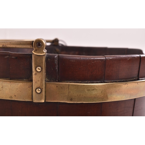 335 - A George III 18th century brass bounded mahogany plate bucket with liner. The bucket having a brass ... 