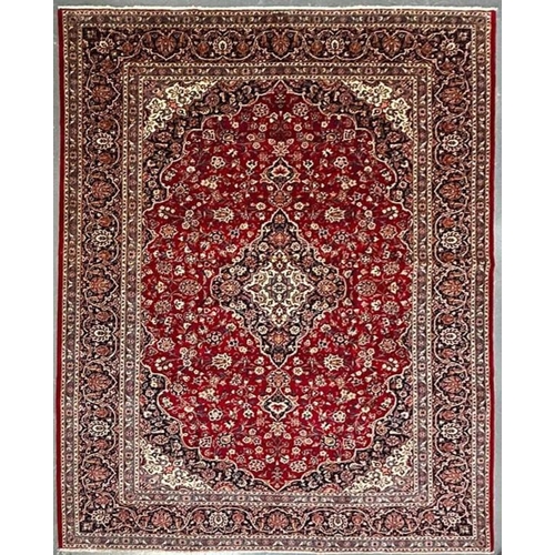 336 - A 20th century Central Persian Islamic Kashan floor carpet rug. The rug having a central floral meda... 