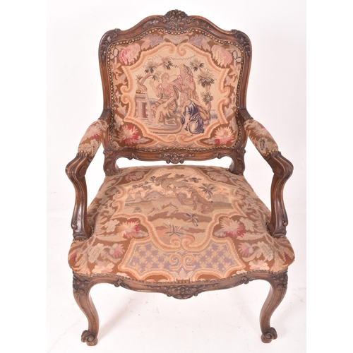 339 - A French continental 19th century oak & petit point fautil upholstered armchair. The chair having a ... 